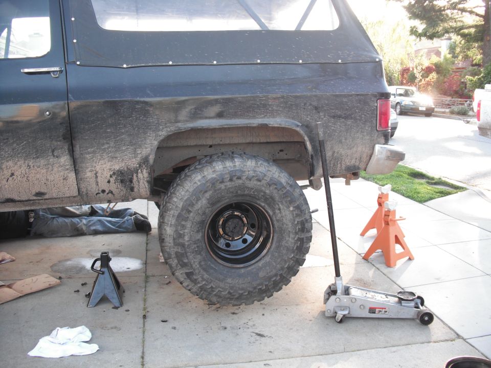 1991 Ford Bronco side view, rear wheel off, on jack stands