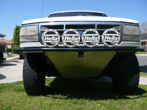 1988 Ford Bronco - Front view of a white Ford Bronco, likely from the early to mid-1990s, equipped with four Hella driving lights.