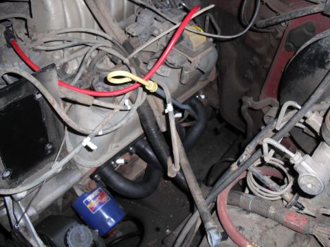 1991 Ford Bronco - Close-up view of an engine bay, highlighting the exhaust manifold and associated components.