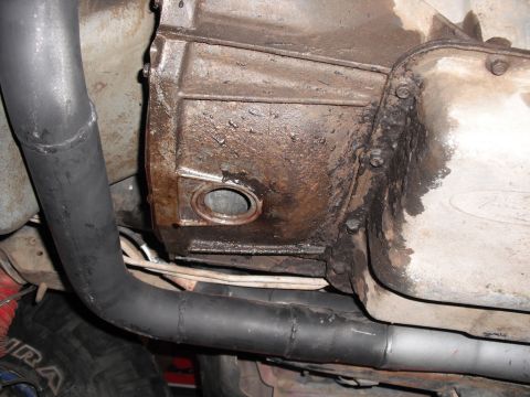 1991 Ford Bronco - Underside view of a vehicle's transmission housing and exhaust system.