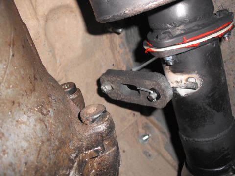 1991 Ford Bronco - Close-up view of a vehicle's exhaust system and transmission components.
