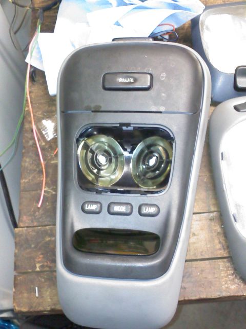 1992 Ford Bronco - This is an interior part of a vehicle, likely an overhead console, with visible buttons and light fixtures.