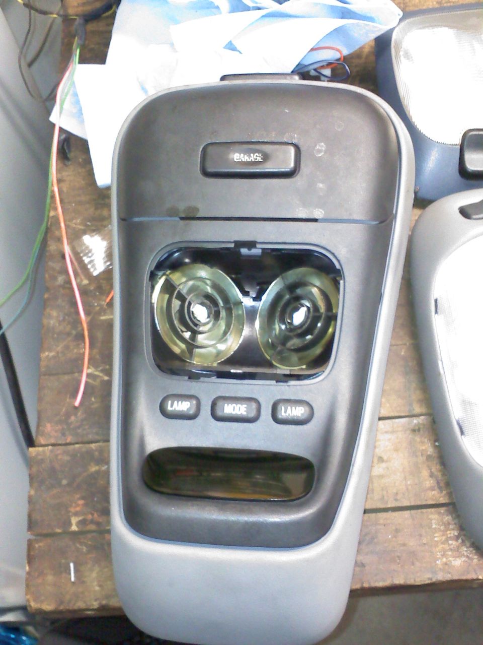 overhead console with two lights, lamp and mode buttons, and a slot