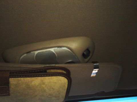 1992 Ford Bronco - The interior of a 1992 Ford Bronco, showing the overhead console and sun visor.
