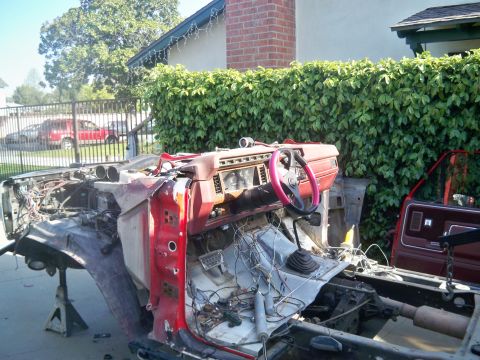 1985 Ford Bronco - This disassembled vehicle's interior and chassis are visible, with the dashboard and steering wheel prominent.