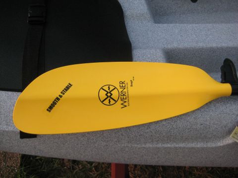 1953 Ford Mainline - Close-up of a yellow Werner kayak paddle, showing brand details and a 'SMOOTH & STABLE' sticker.