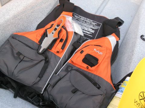 1953 Ford Mainline - Life vests and a multi-tool knife are stored inside a kayak.