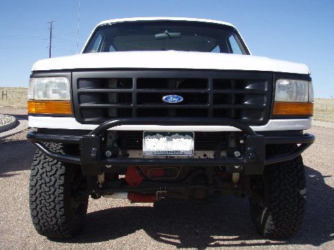 1993 Ford Bronco - Front view of a white Ford Bronco, likely a 1992 model, with a custom bumper and grille.