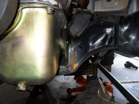 1997 Ford Ranger - Close-up view of a vehicle's undercarriage, showing the frame and oil pan.
