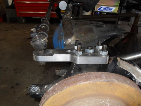 1997 Ford Ranger - This image shows a custom steering linkage bracket installed on a vehicle's suspension system.