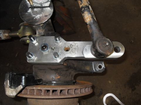 1997 Ford Ranger - Modified suspension part attached to a brake rotor, with a tie rod end visible.
