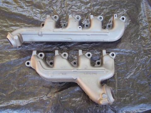 1972 Ford Ranchero - Two exhaust manifolds are shown, likely for a V8 engine, with casting numbers visible on their surfaces.