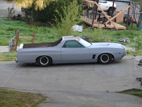 1973 Ford Ranchero - Side view of a primer-gray 1972 Ford Ranchero pickup truck.
