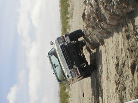 1978 Ford Bronco - This SUV appears to be stuck on a sandy incline, with its front end angled upwards.