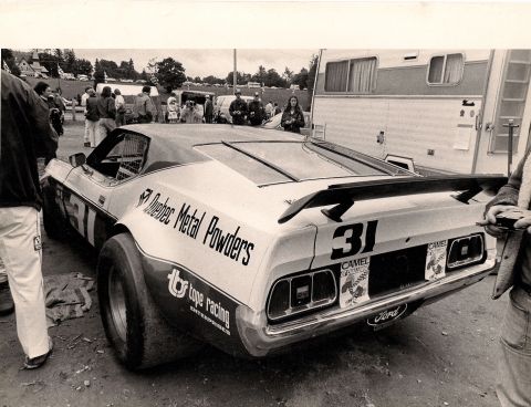 1973 Ford Mustang - A 1973 Ford Mustang race car, number 31, displays sponsor decals including Quebec Metal Powders and Camel.