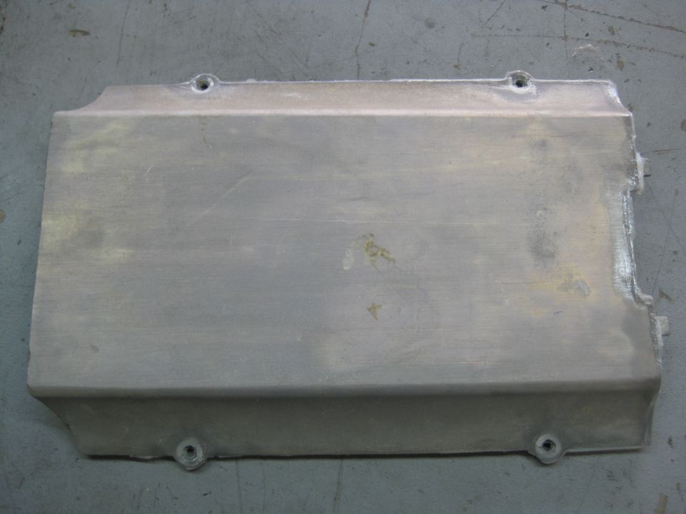 Rectangular metal engine cover with mounting holes