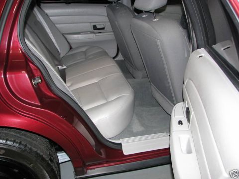 2005 Ford Crown Victoria - The interior of a 2005 Ford Crown Victoria shows the rear seating area.