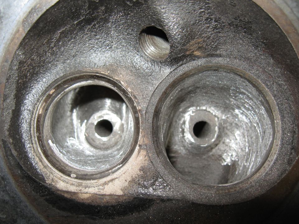 Engine cylinder head with two valve openings and visible wear