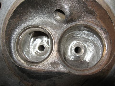 1994 Ford Bronco - Engine cylinder head showing two combustion chambers with intake and exhaust ports.