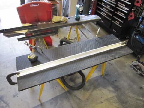 1996 Ford Bronco - Workbench setup with tools for a project, including clamps and a drill.