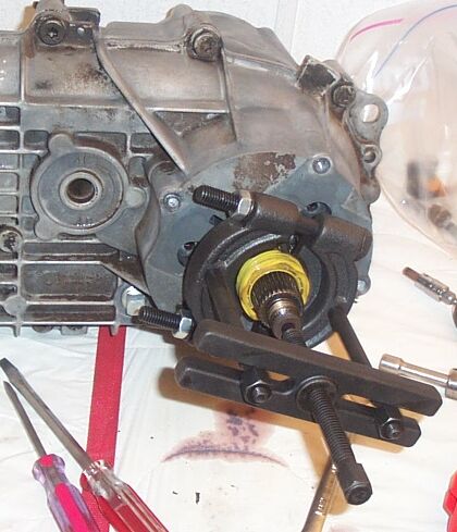 1990 Ford Bronco - I used my bearning splitter to pull the drive gear off, but you can use long screwdrivers or pry bars *if you're careful*