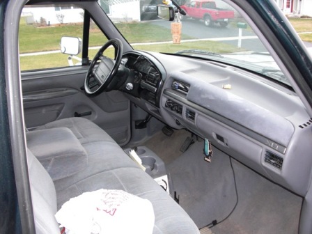 1995 Ford F-150 - Interior view of a 1995 Ford F-150, showing the dashboard, steering wheel, and front seats.