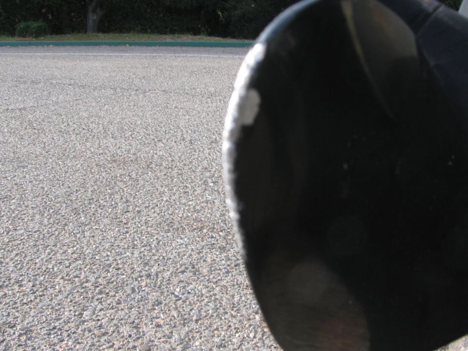 Black boat propeller with chipped edge