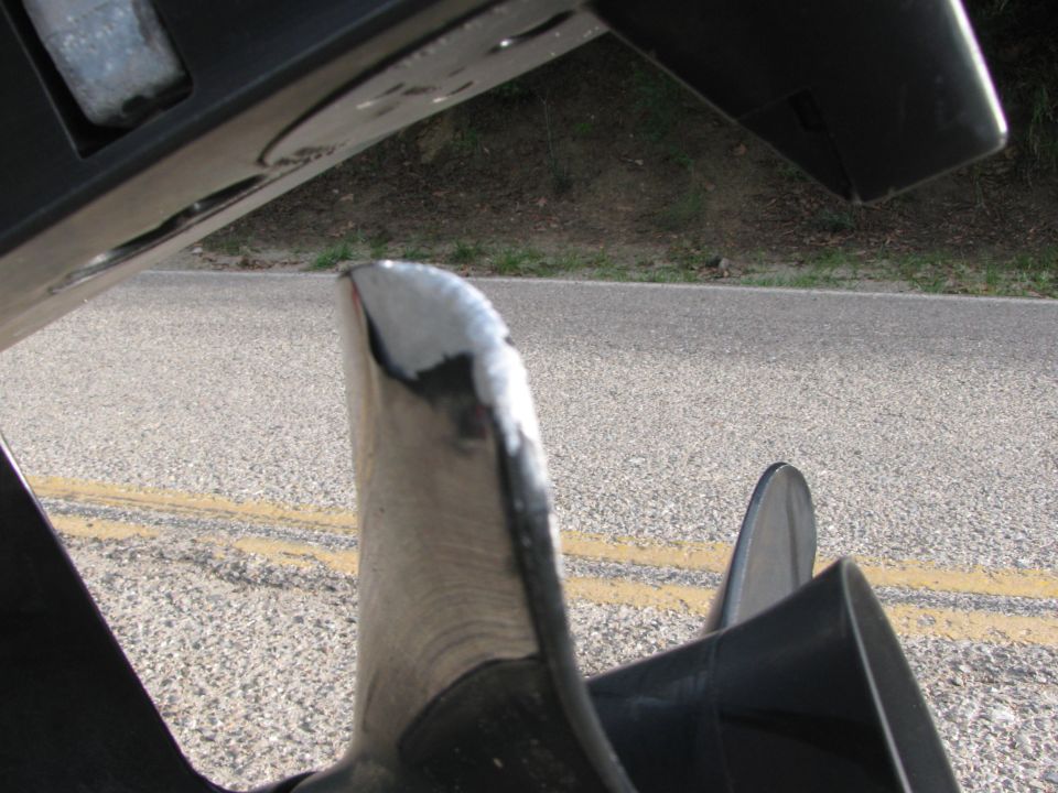 Close-up of a damaged boat propeller with chipped edges