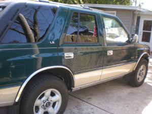 1993 Isuzu Rodeo - Side profile of a 1993 Isuzu Rodeo SUV, showing its two-tone paint scheme.