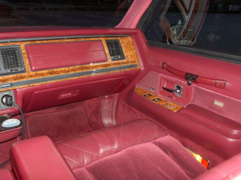 1993 Lincoln Town Car - Interior view of a 1993 Lincoln Town Car, showing the dashboard and door panel.