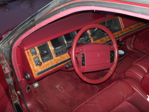 1993 Lincoln Town Car - Interior view of a 1993 Lincoln Town Car, showing the dashboard, steering wheel, and seats.