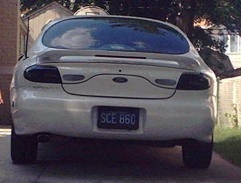 1997 Ford Taurus - This 1997 Ford Taurus is seen from the rear, tinted taillights and a spoiler.