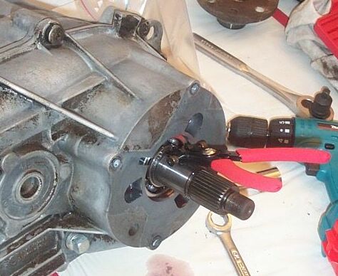 1990 Ford Bronco - Now you must remove this snap ring; be sure you have _quality_ snap ring pliers. I eventually went to Snap On.