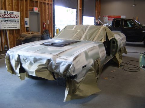 1973 Ford Ranchero - A 1973 Ford Ranchero is being prepped for painting in a garage, with a black pickup truck visible in the background.
