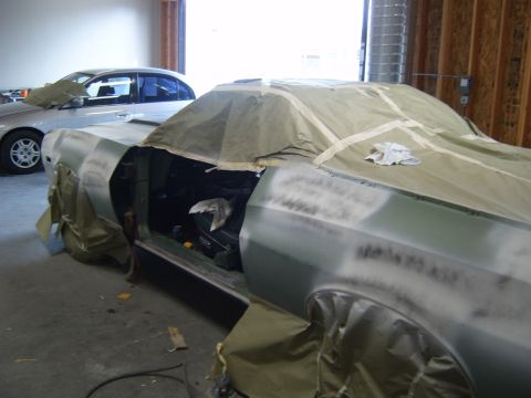1973 Ford Ranchero - A car in a workshop is being prepped for painting, with another vehicle visible in the background.