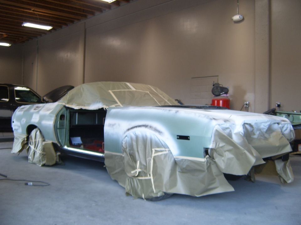 1973 Ford Ranchero covered in masking paper and plastic, ready for paintwork