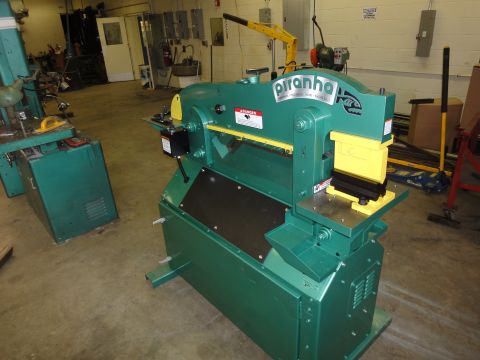 1996 Ford Bronco - A green Piranha metal shear machine is shown in a workshop setting.
