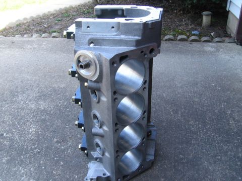 1972 Ford Ranchero - Freshly machined V8 engine block standing upright on a concrete driveway, angled to show one bank of four freshly honed cylinder bores and…