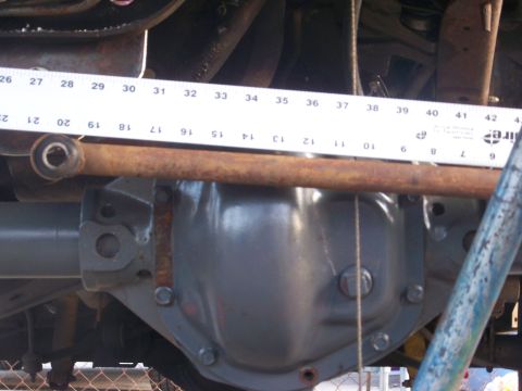1989 Ford Bronco - Close-up of a rear axle differential with a measuring tape indicating a length of about 34 inches.