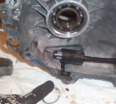 1990 Ford Bronco - This is the oil pump pickup. Black rectangular magnet underneath it slides into a notch in the case