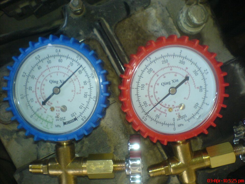 Blue and red A/C manifold gauges reading static pressure with engine off
