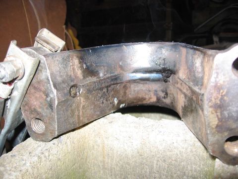 1989 Ford Bronco - This is a close-up view of a metal bracket that has been welded and shows signs of wear.