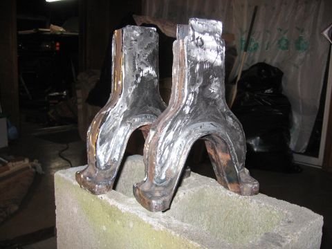 1989 Ford Bronco - These fabricated metal components appear to be parts for a vehicle's suspension or drivetrain.