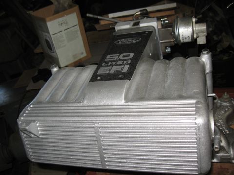 1994 Ford Bronco - A silver 5.0 Liter EFI intake manifold, likely from a Ford vehicle, is shown in detail.