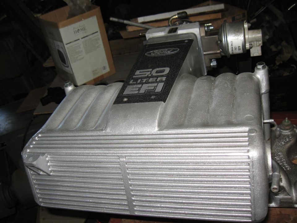 Silver 5.0 Liter EFI intake manifold with Ford logo