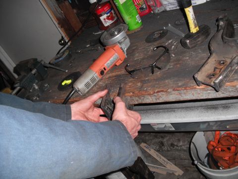 1991 Ford Bronco - A workbench is set up with tools and materials for a metalworking project.