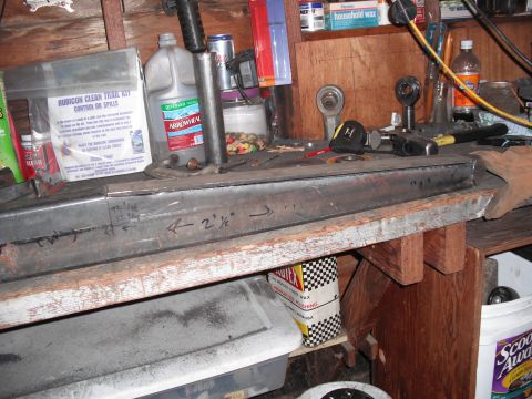 1991 Ford Bronco - Metal fabrication project underway on a workbench with various tools and supplies.