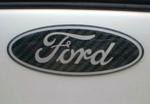 1997 Ford Taurus - A Ford emblem is shown on a white surface, with a website address visible at the bottom.