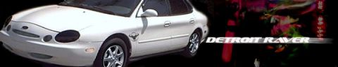 1997 Ford Taurus - A white 1997 Ford Taurus sedan is shown from the front 3/4 angle, with a graphic on the right side.