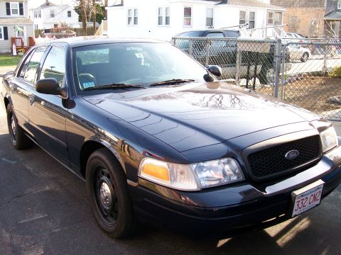 2007 Ford Crown Victoria - This Ford Crown Victoria is parked in a residential area. The front grille and headlights are visible.
